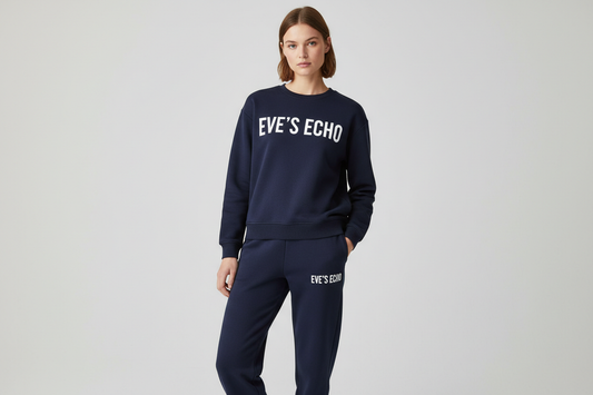 create an image of a white female wearing  a navy blue sweat shirt and sweat pants with EVE'S ECHO on the center of the shirt, and Eve's ECHO stacked vertically on the left pant by the pocket. 